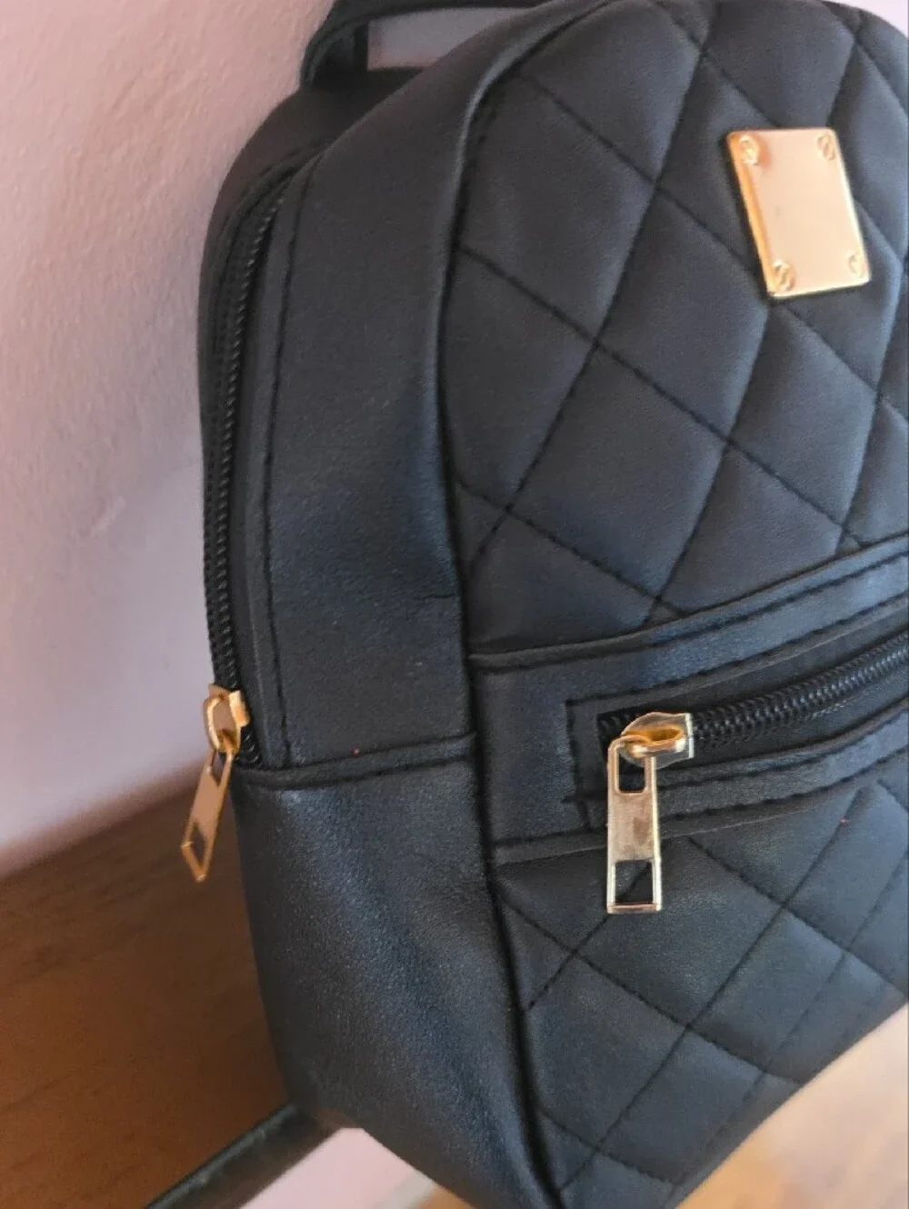 Quilted Black Mini Backpack with Gold Accent